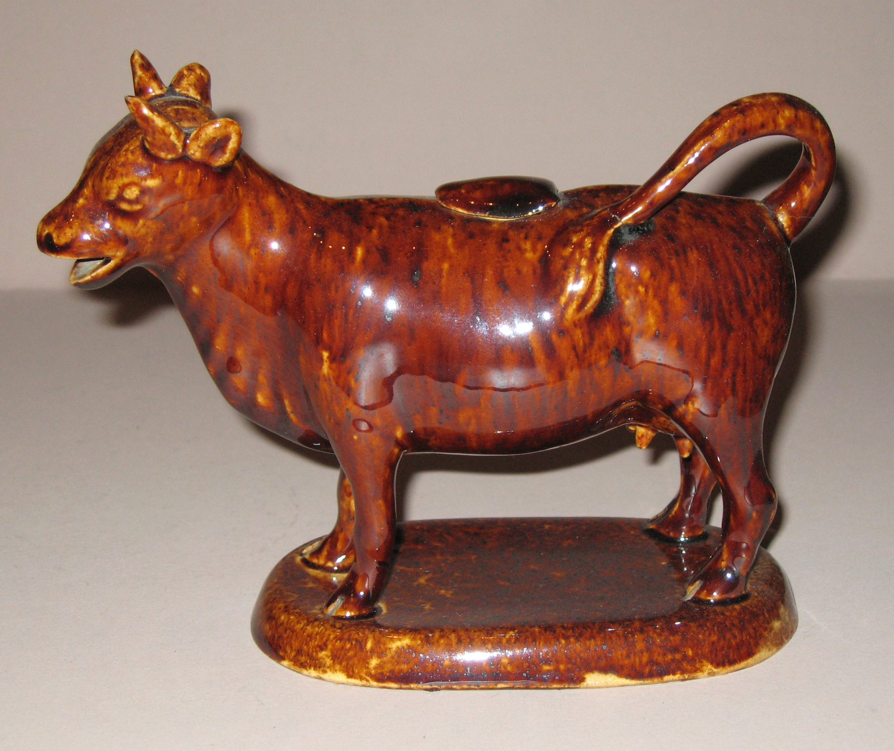 1967.1870 A, B Earthenware cow creamer