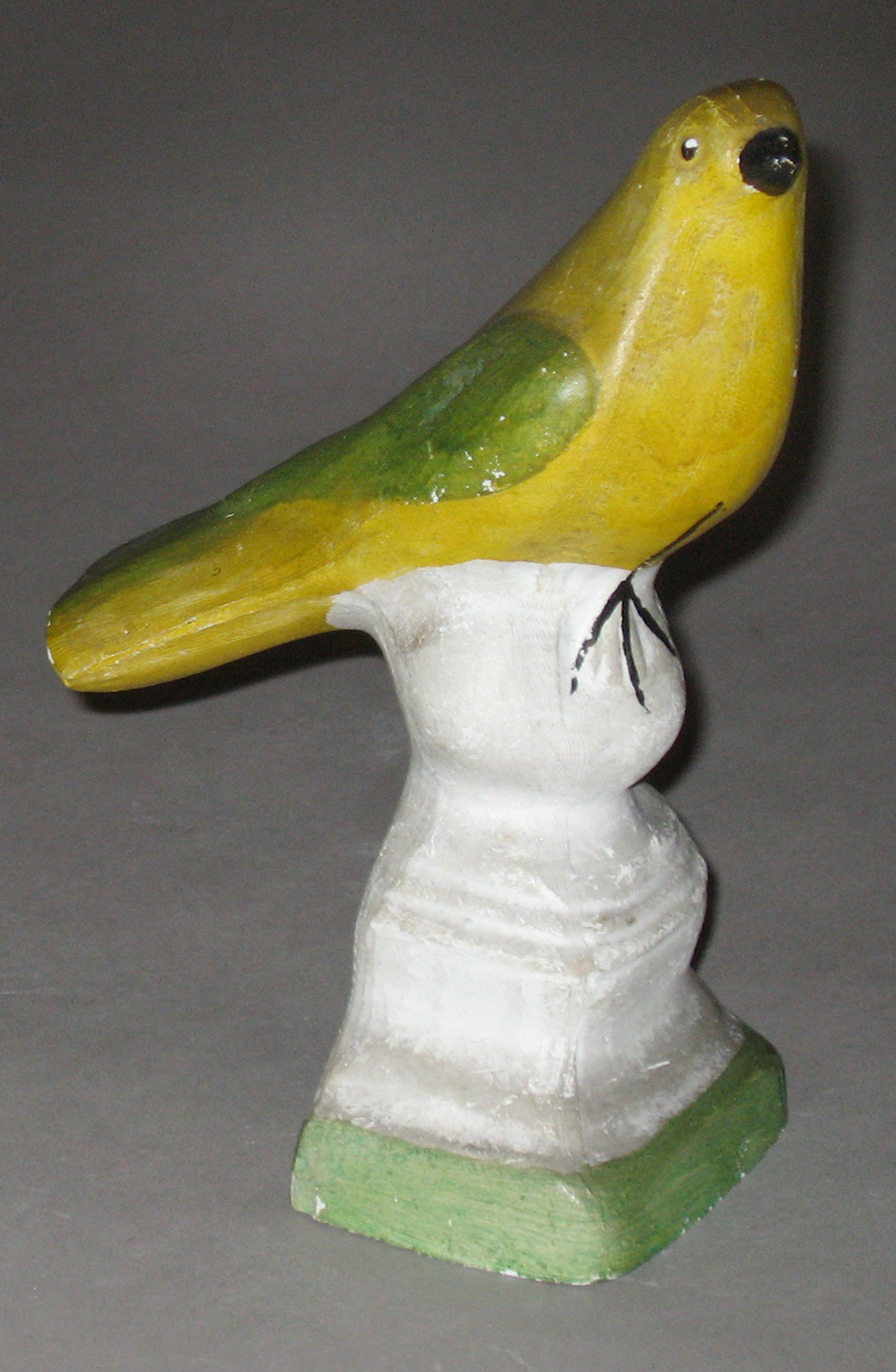 1964.1695 Chalkware bird on ball