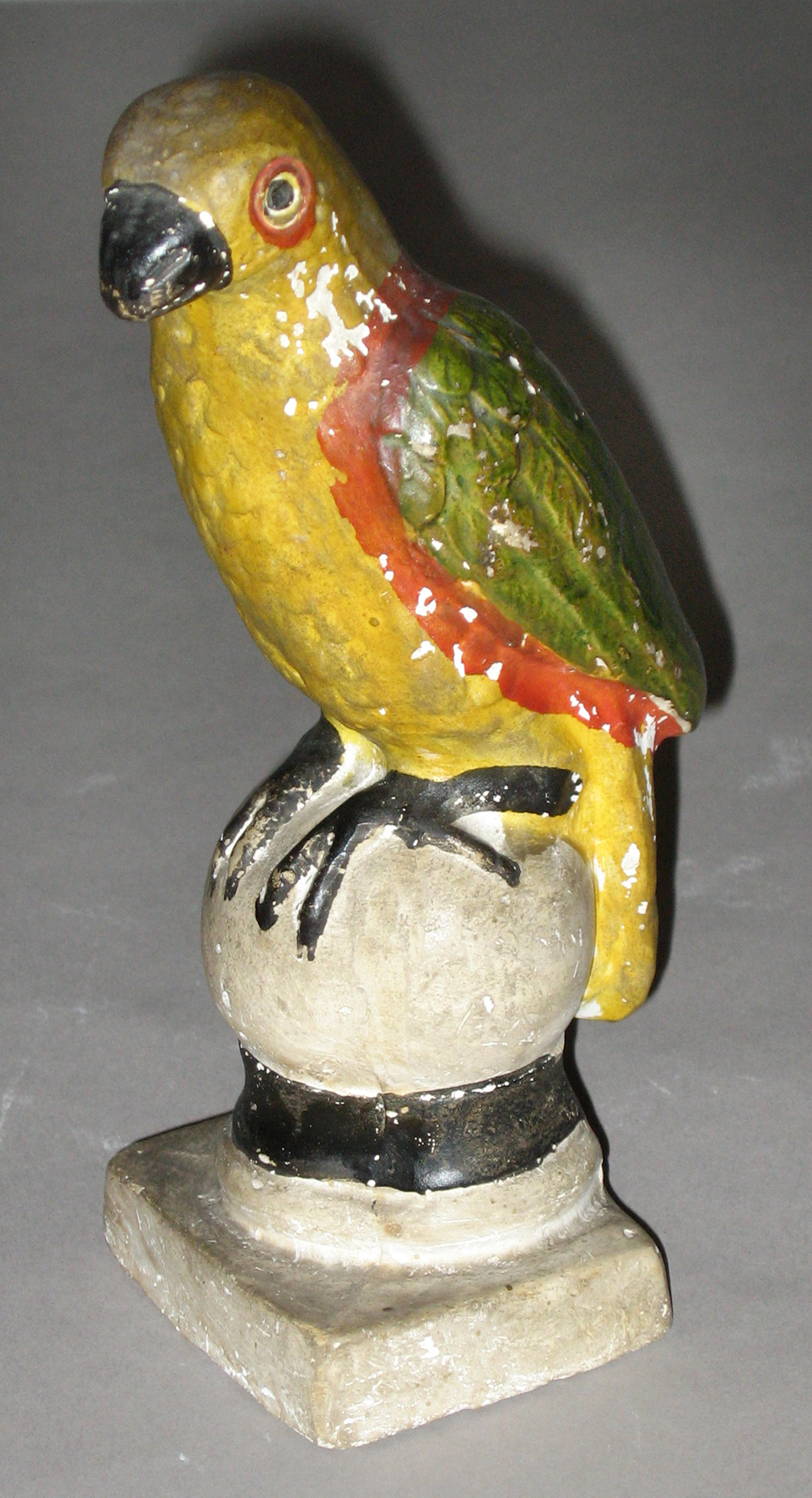 1964.1714 Chalkware parrot on ball