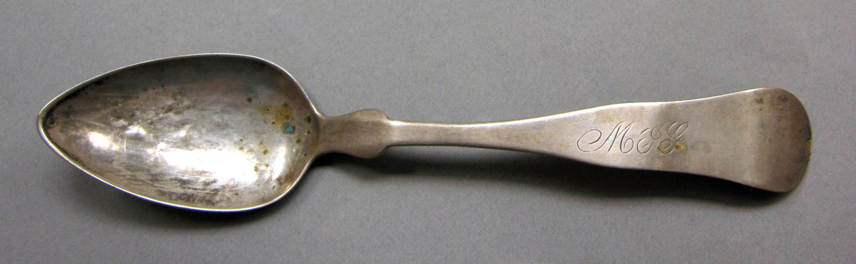 1962.0240.586 Silver spoon upper surface
