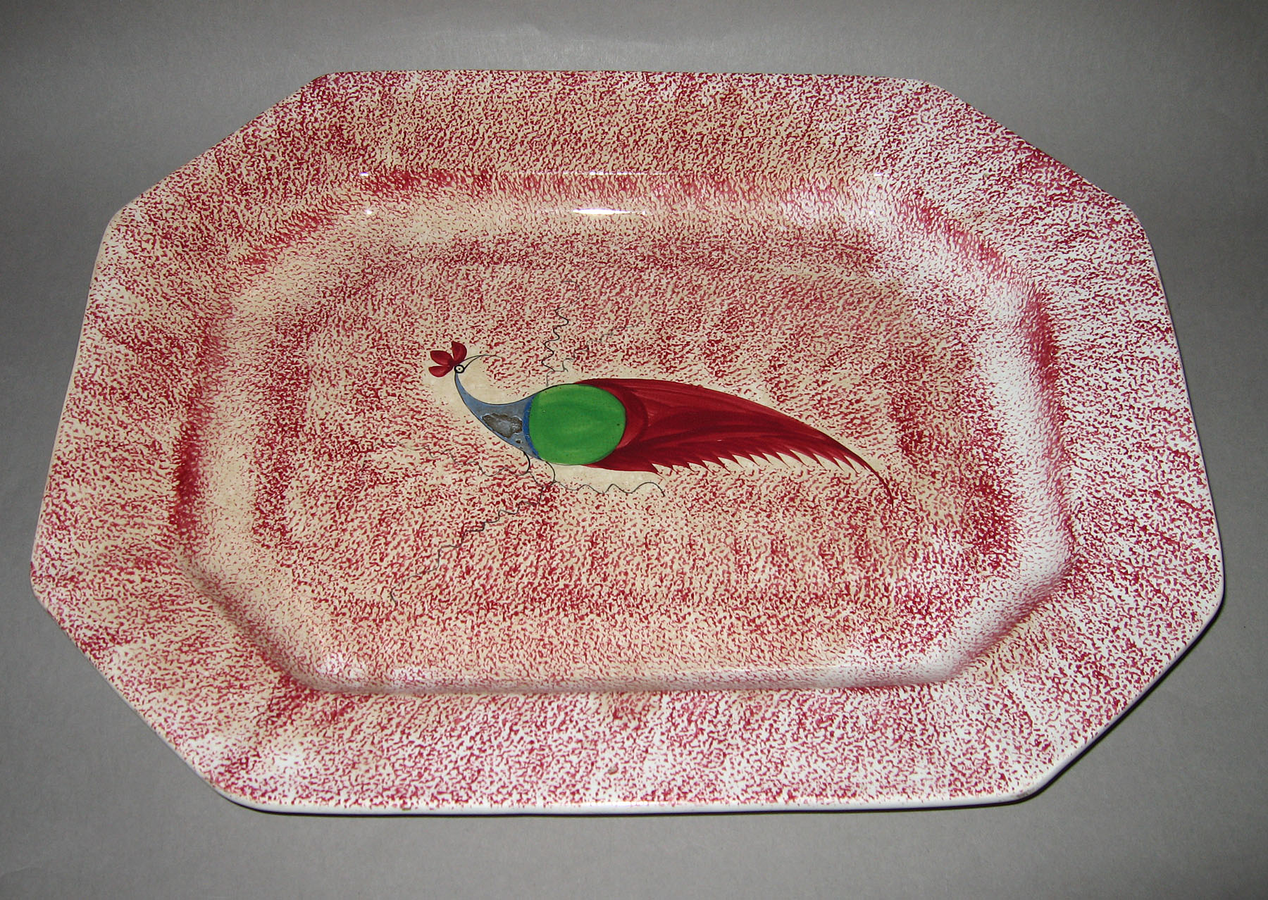 1965.0894.001 Pink spatterware peafowl dish