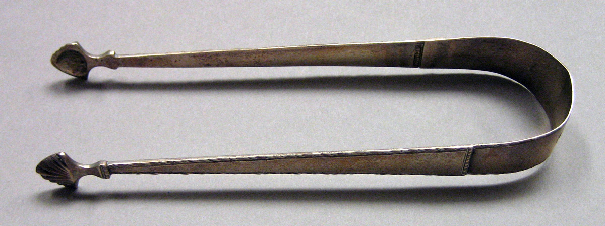 1962.0240.1628 Silver Tongs view 1