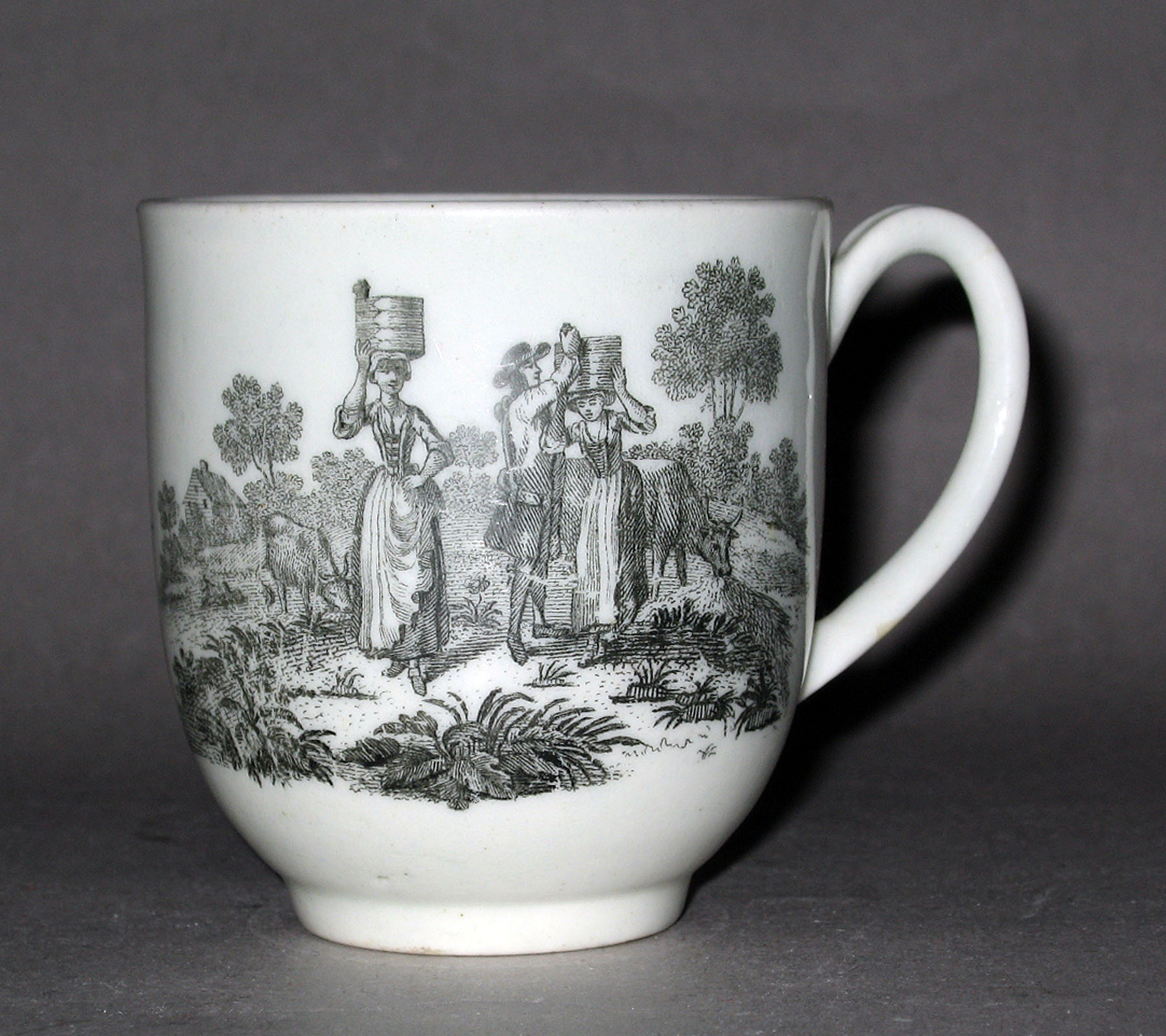1958.0742 Soft-paste porcelain coffee cup (side 1)