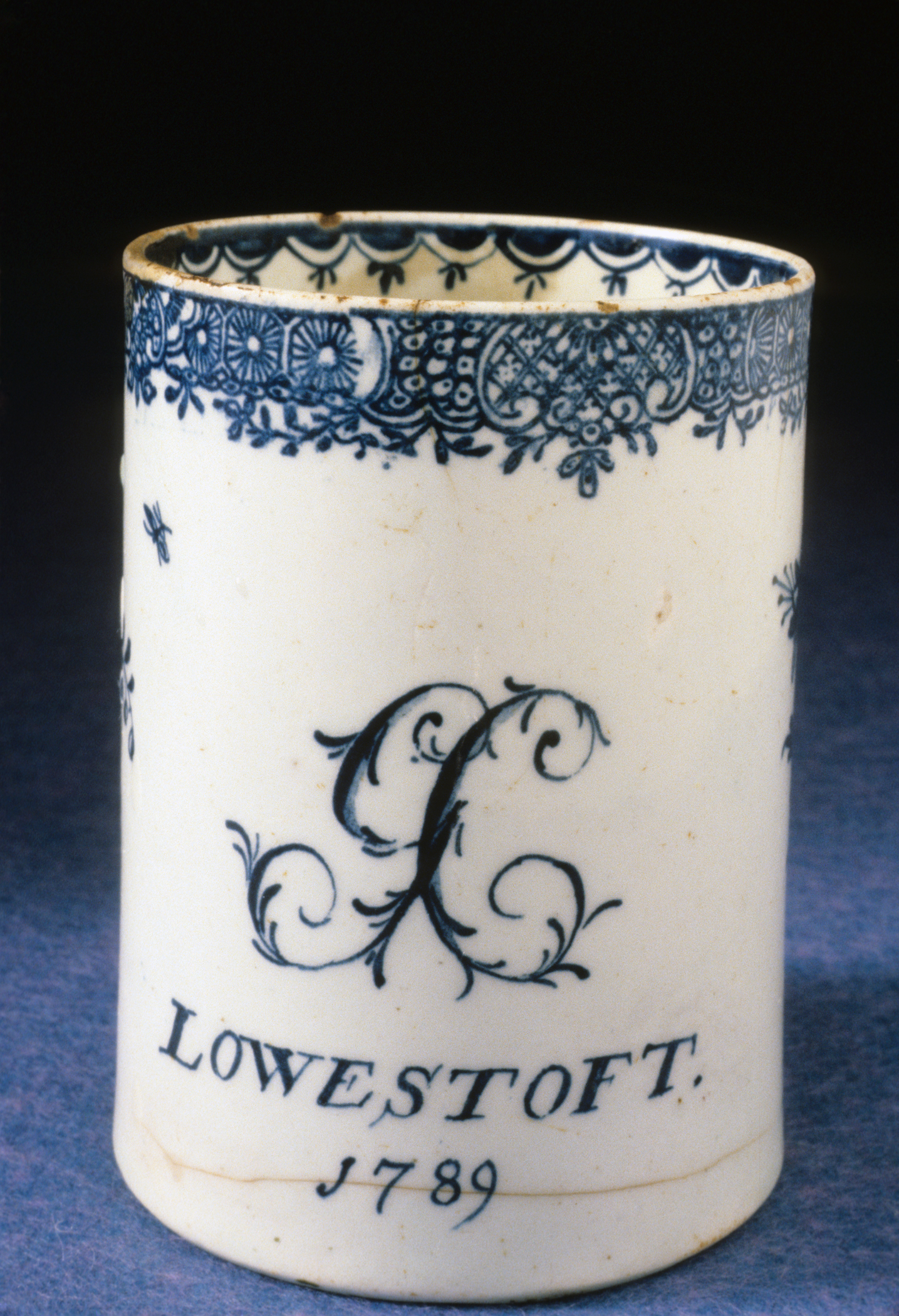 1956.0013.001 Soft-paste porcelain mug (front)