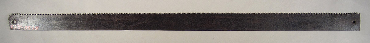 1957.0026.243 Saw blade, side 1