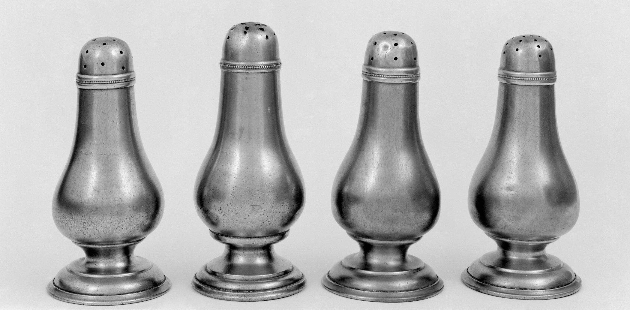 1956.0038.029-.032 Pewter casters