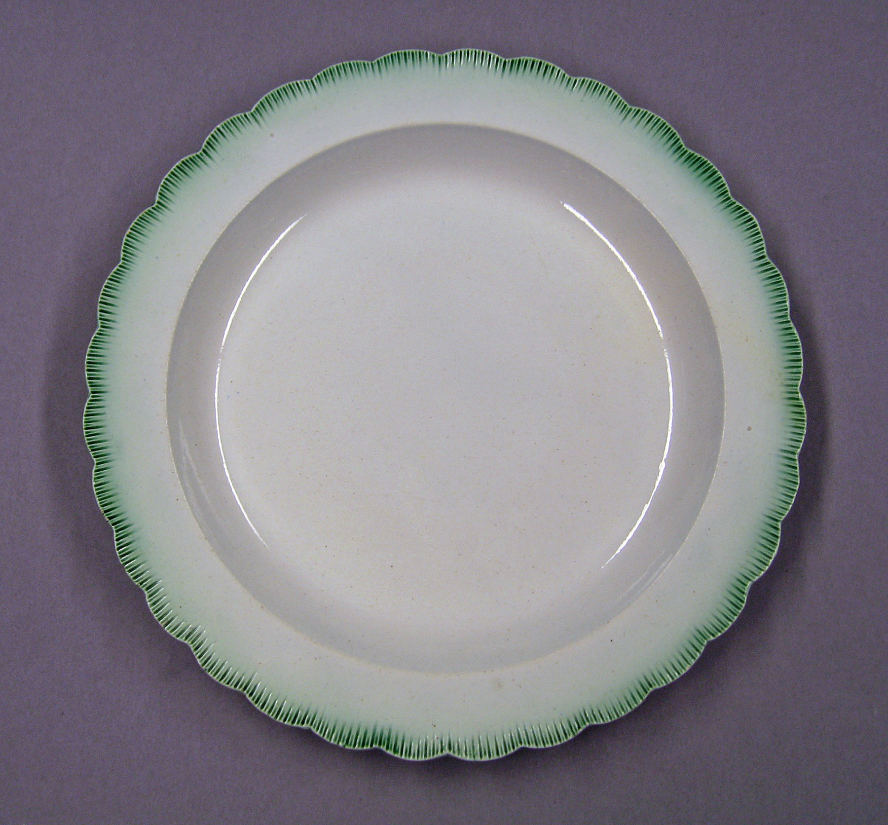 1969.0867.001 Pearlware plate marked SEWELL