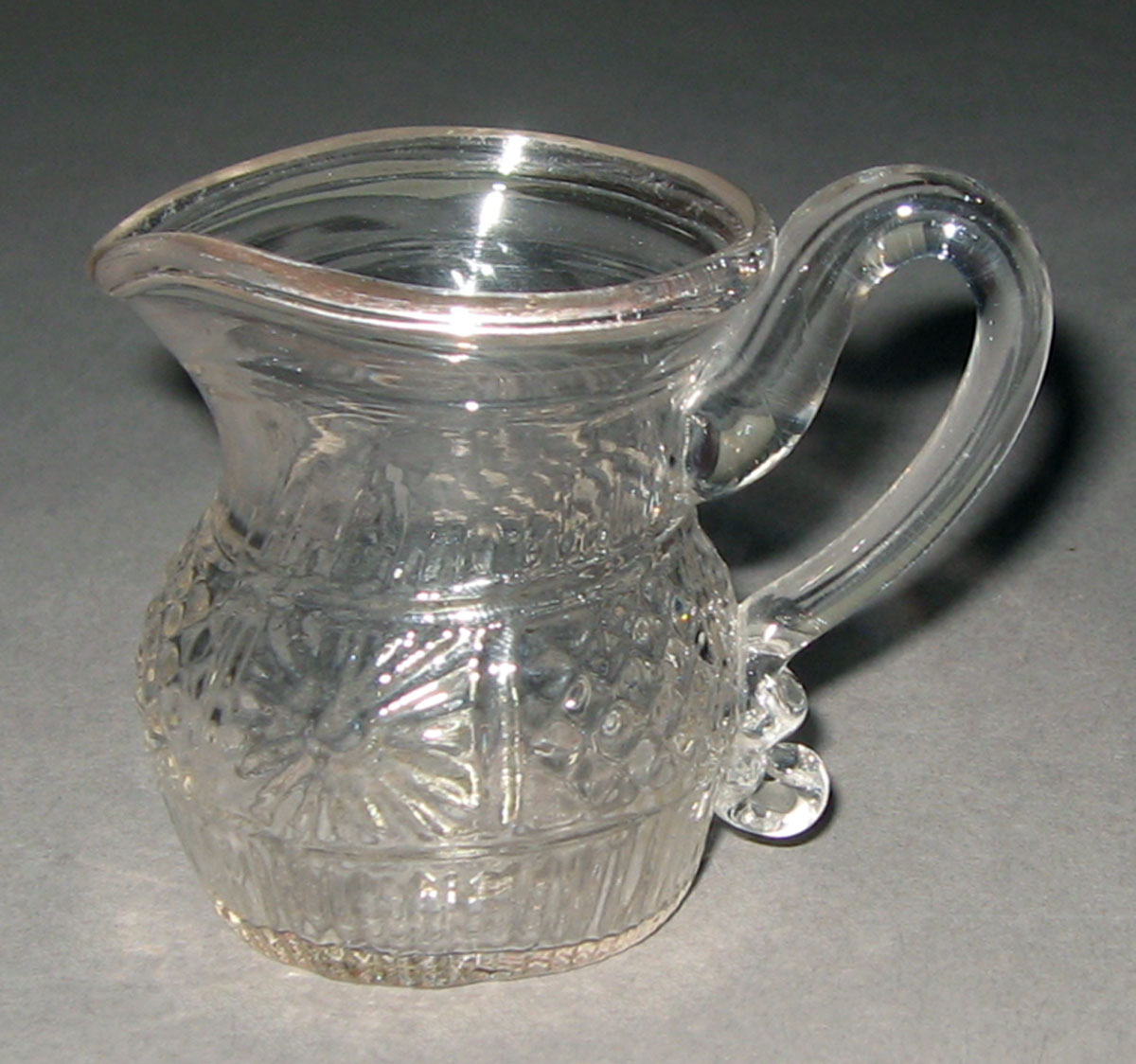 1959.3310 Mold-blown colorless glass jug