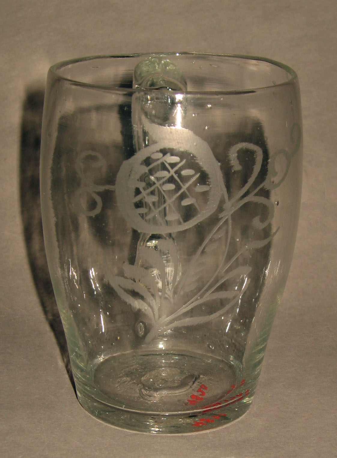 1964.1769 Colorless glass mug