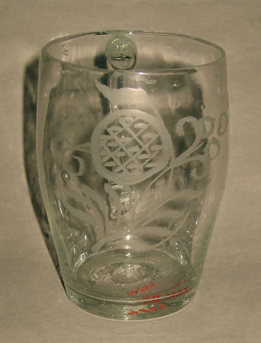1964.1768 Colorless glass mug (front)