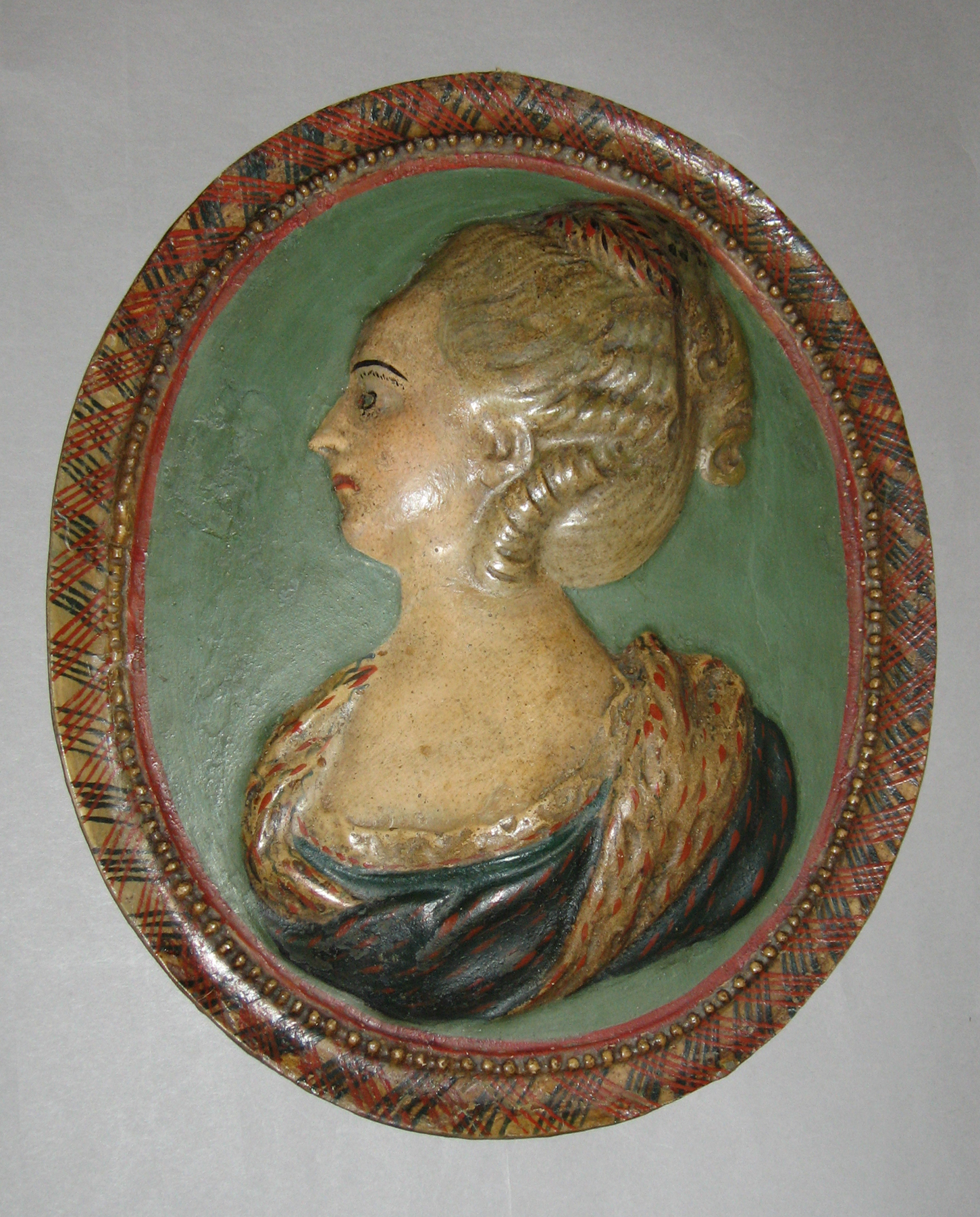 1965.1334.002 Chalkware female portrait plaque