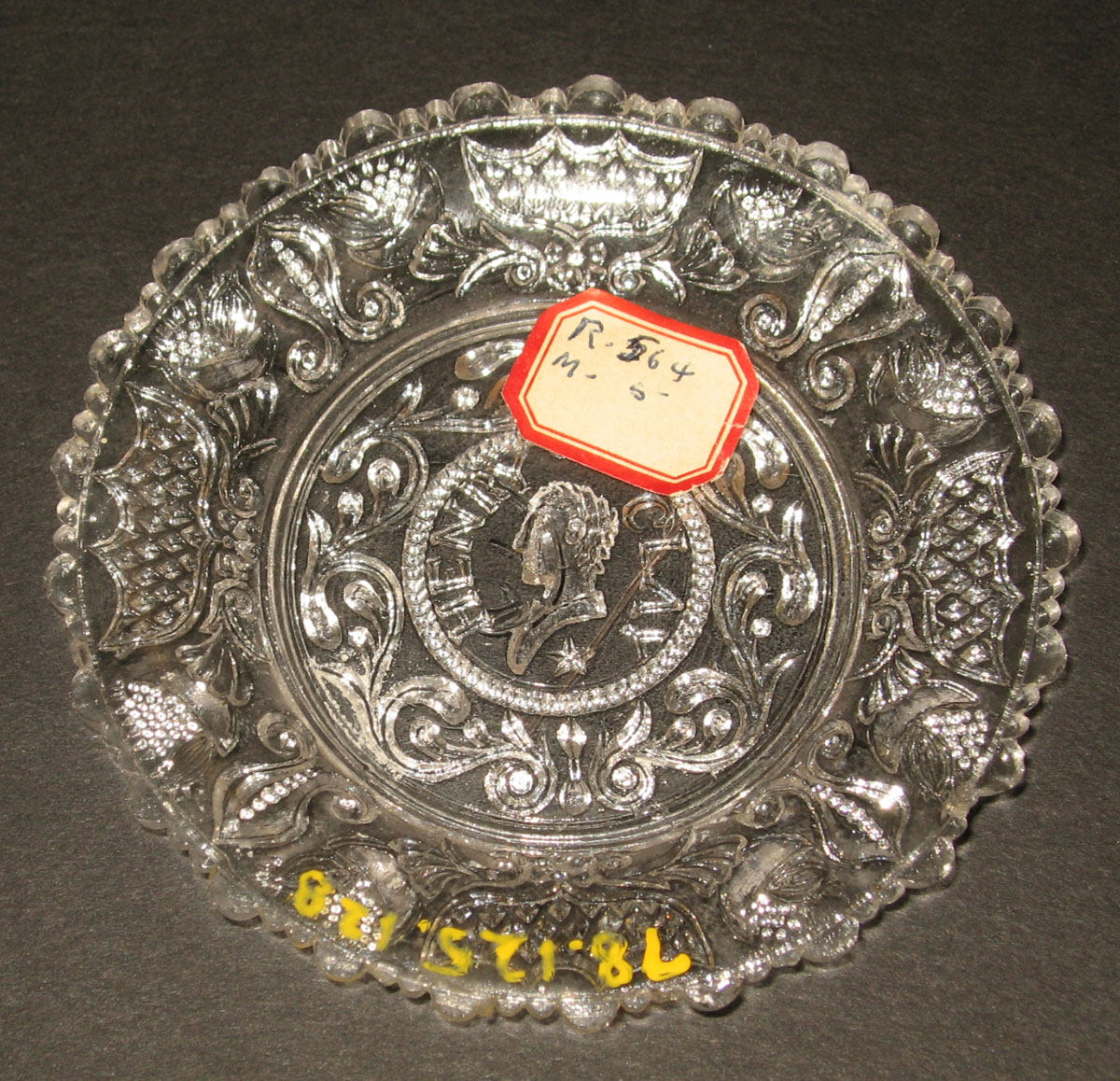 1978.0125.128 Glass cup plate