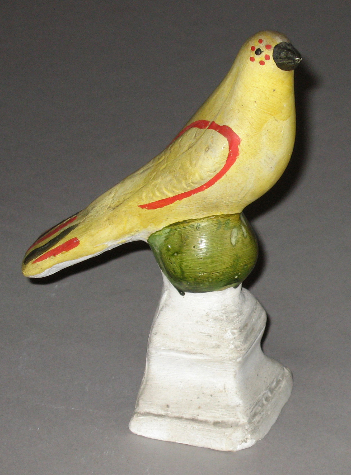 1964.1688 Chalkware bird on ball