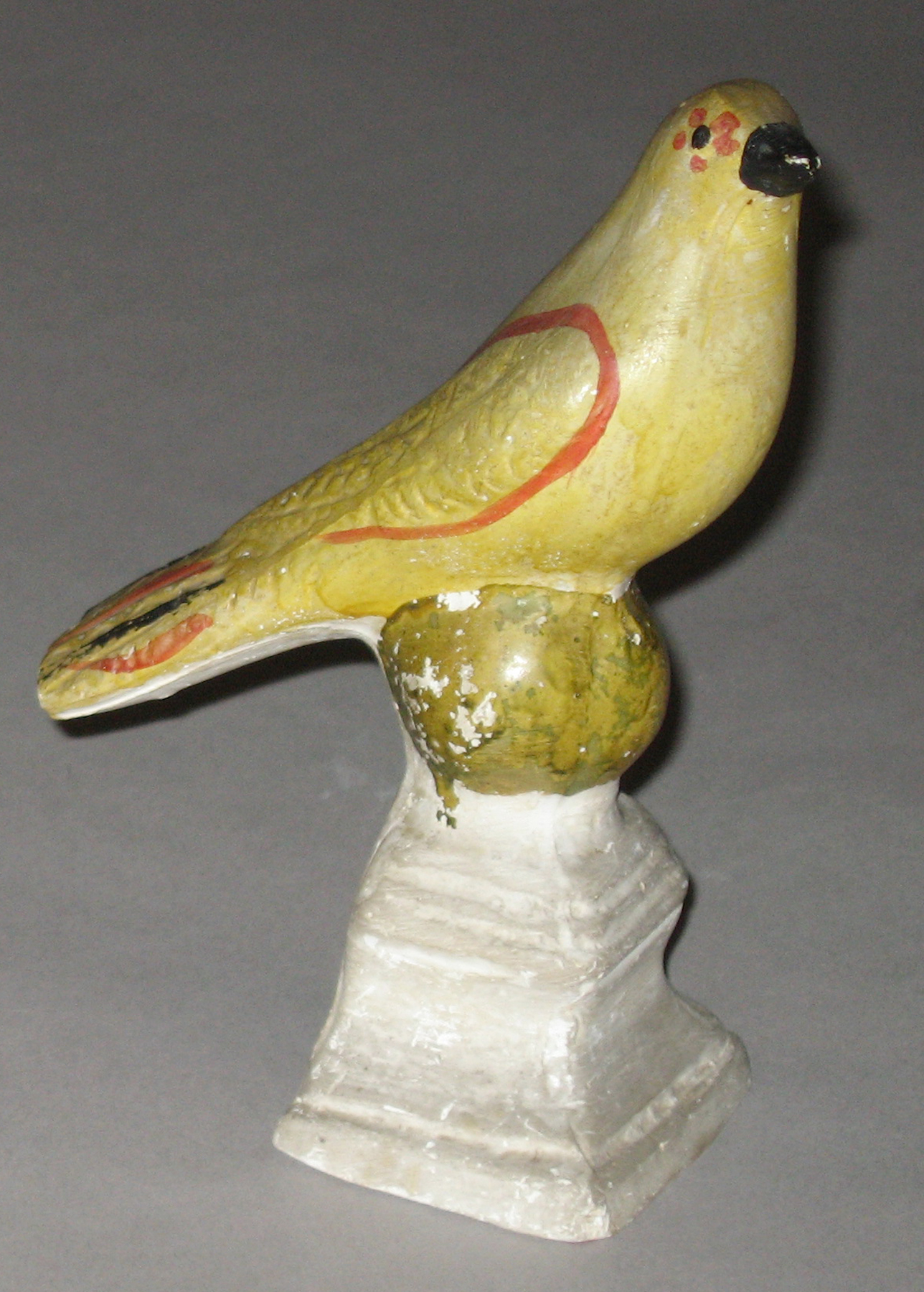 1964.1705 Chalkware bird on ball