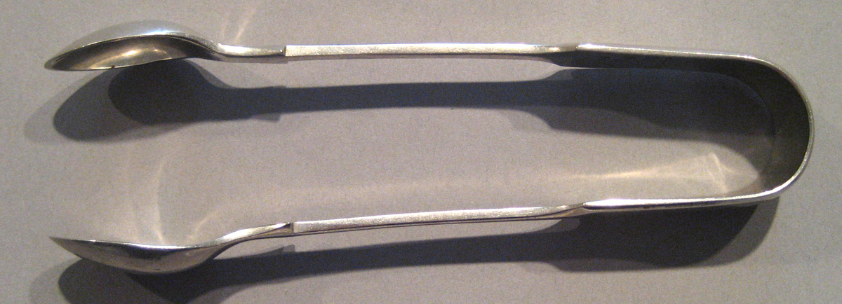 1998.0004.085 Silver Tongs upper surface