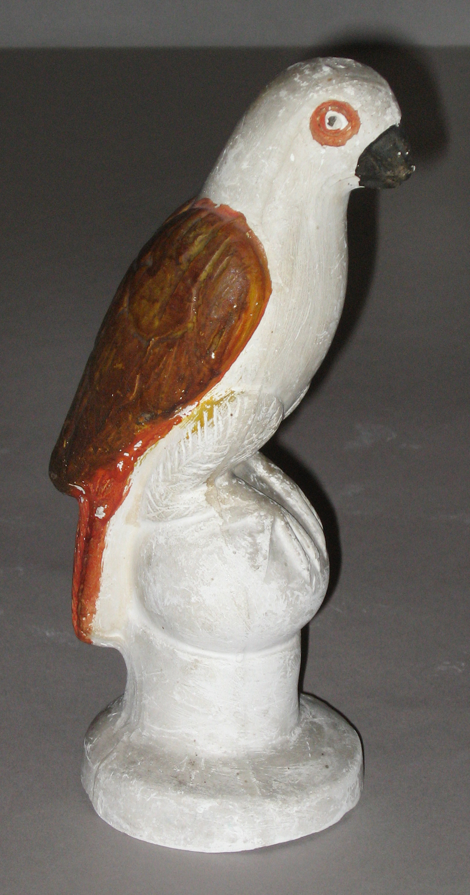 1964.1710 Chalkware parrot on ball