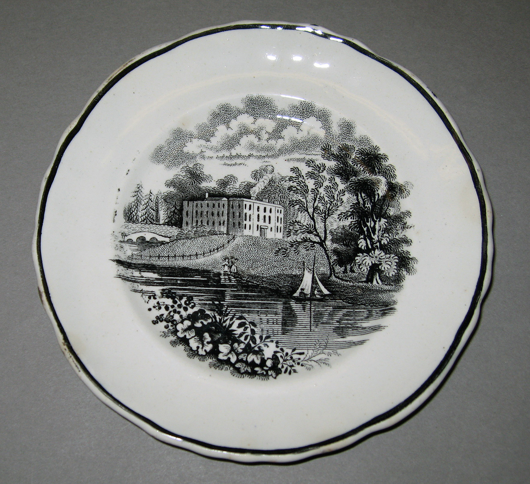 1964.1929 Earthenware cup plate
