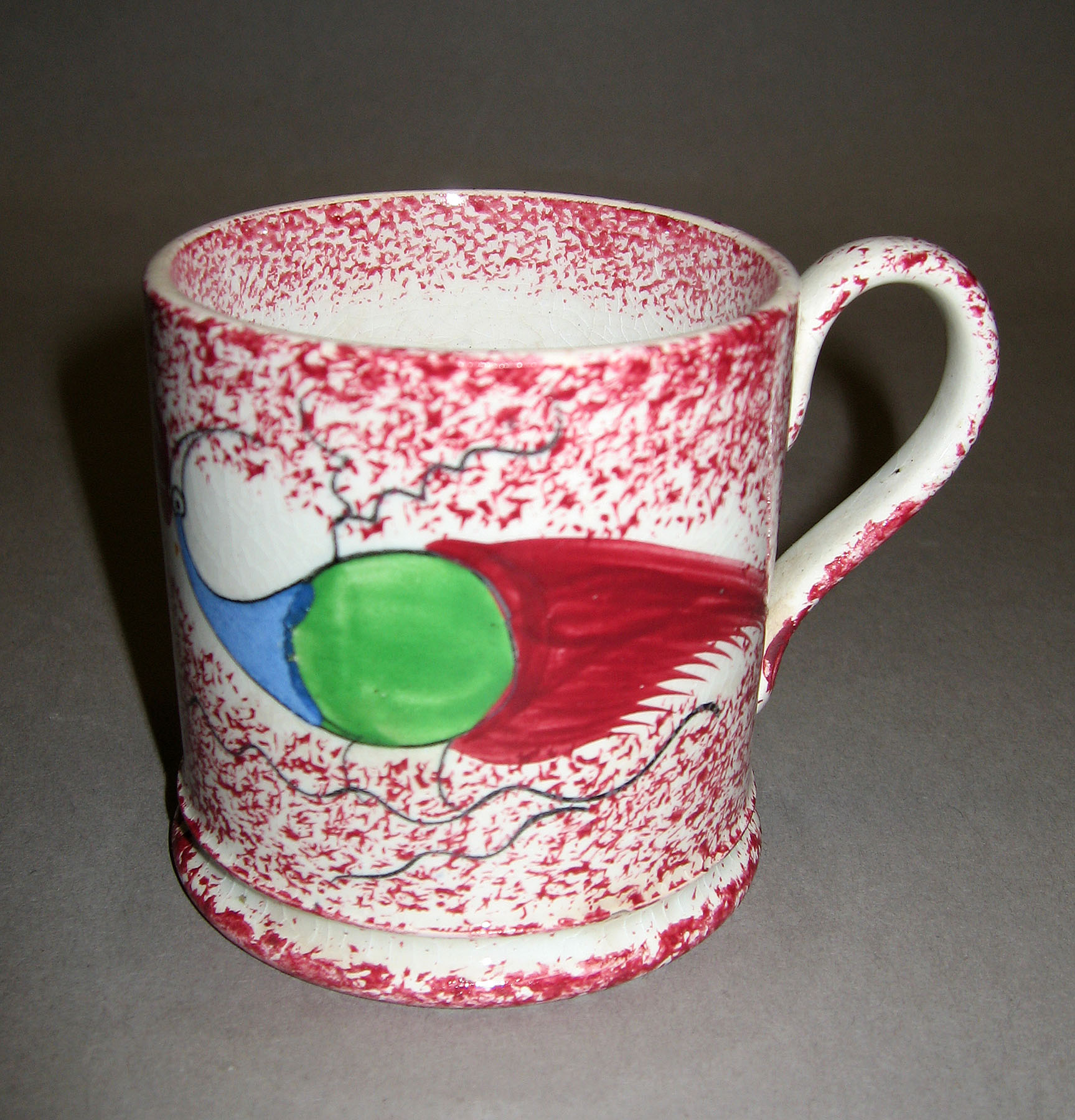 1965.0895.002 Adams Peafowl pink spatterware mug