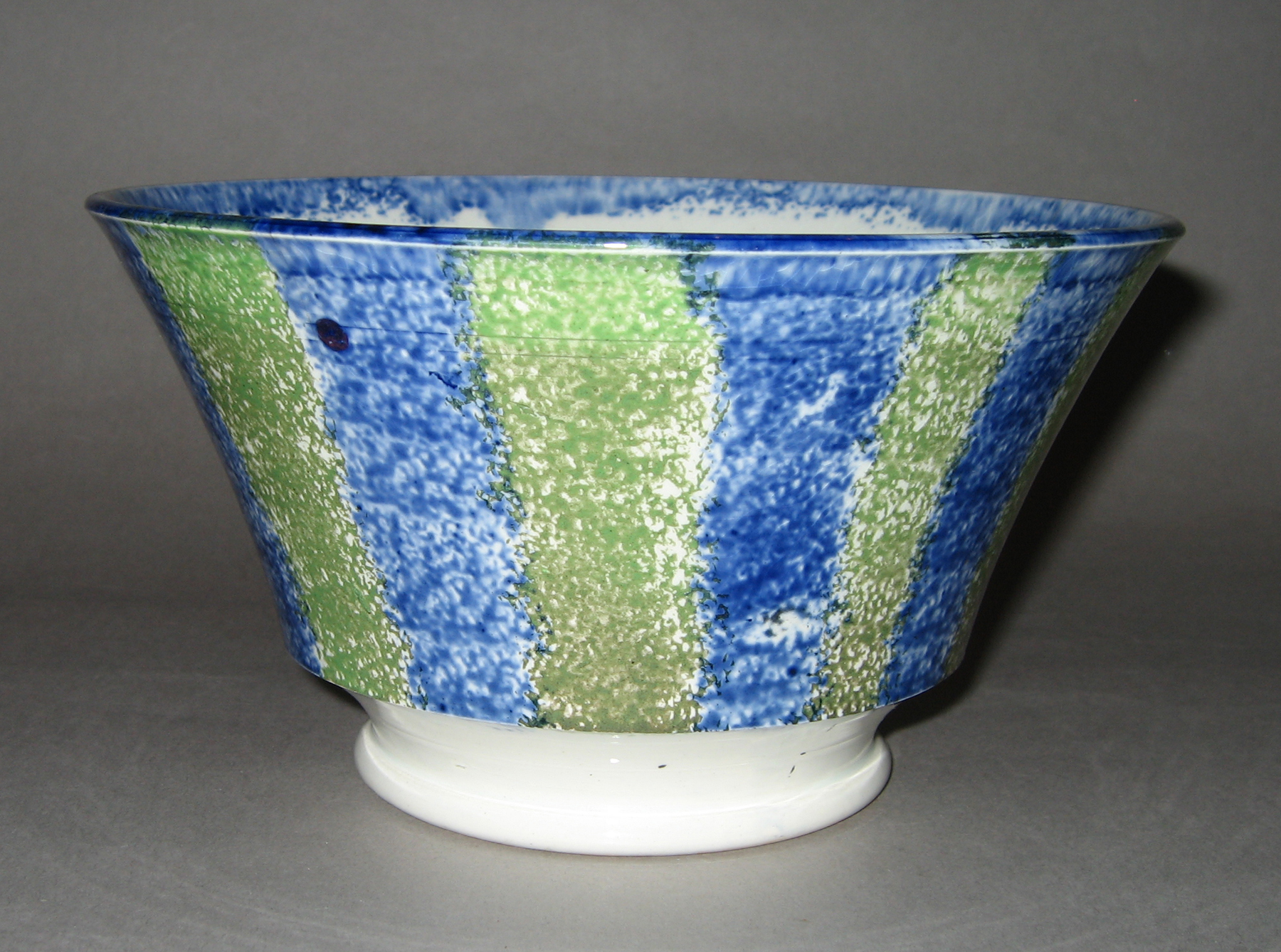 1965.0766.007 Blue and green striped spatterware bowl