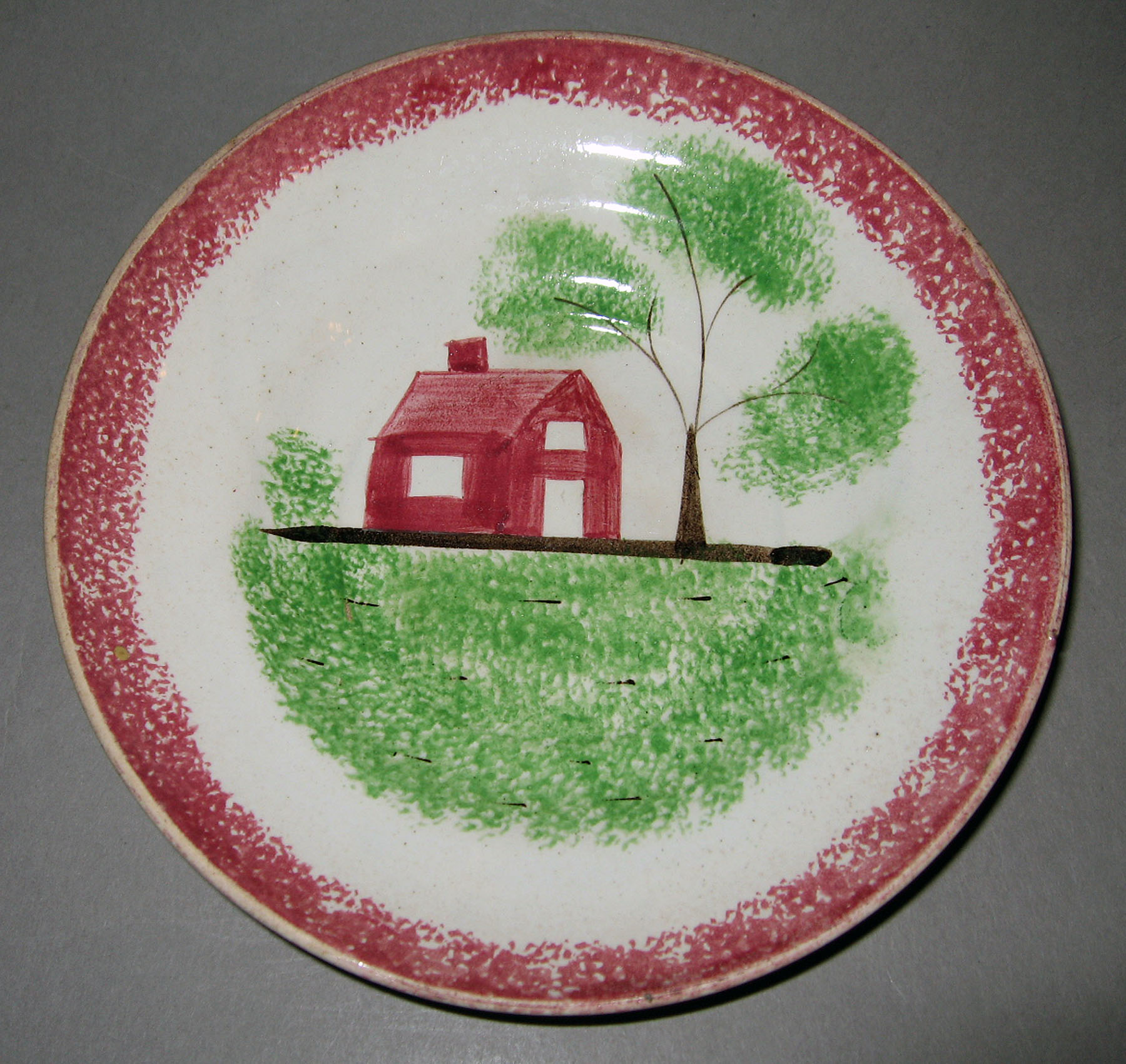 1965.0776.006 Spatterware saucer