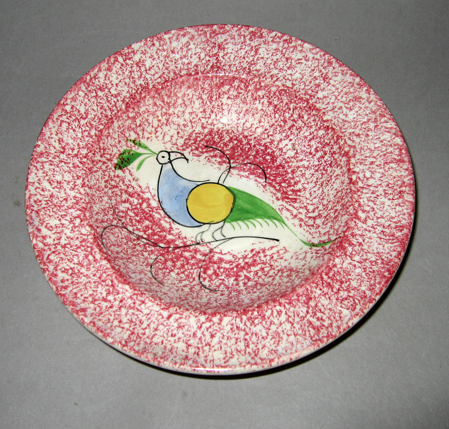1965.0882.001 Pink spatterware peafowl plate