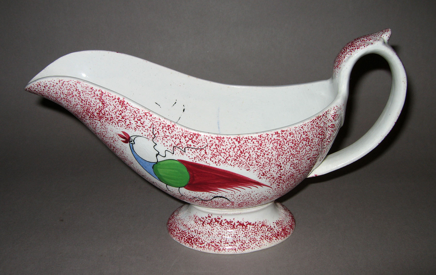 1965.0893 Pink spatterware peafowl sauce boat