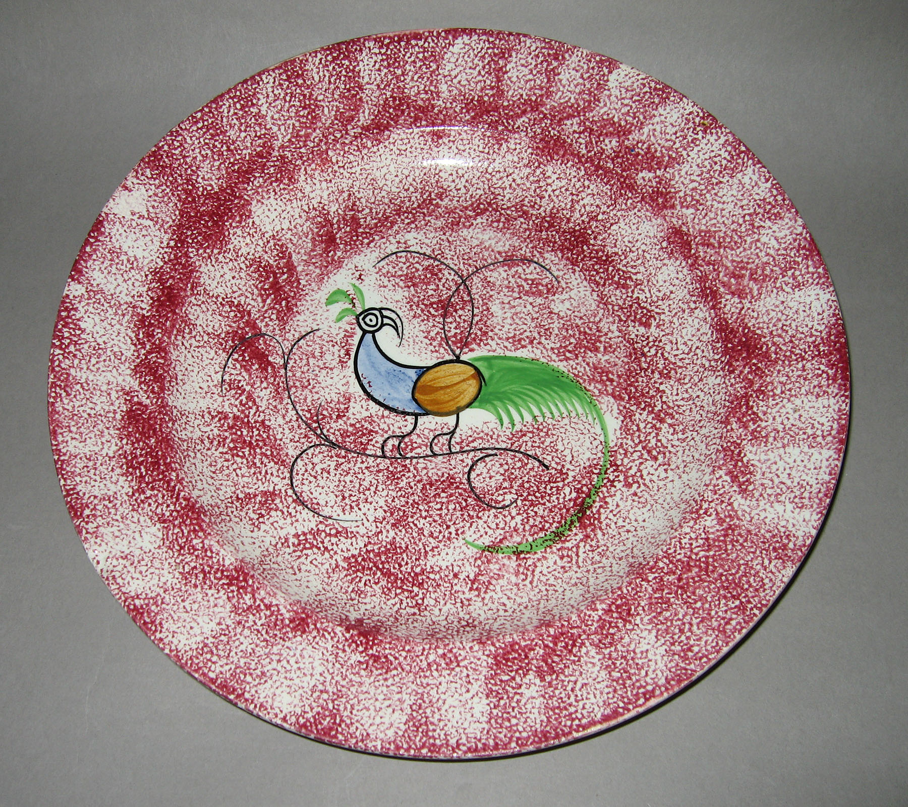1965.0878.001 Pink spatterware peafowl plate