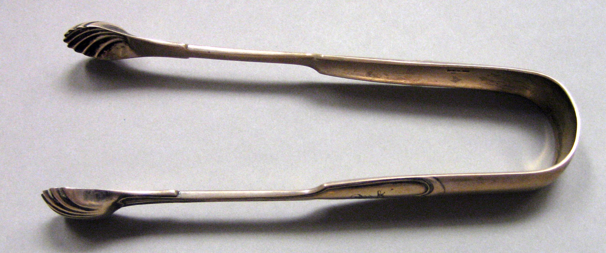 1962.0240.1631 Silver Tongs view 1