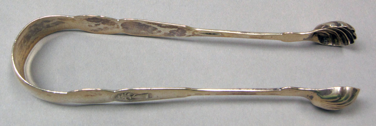 1957.1373 Silver Tongs view 1