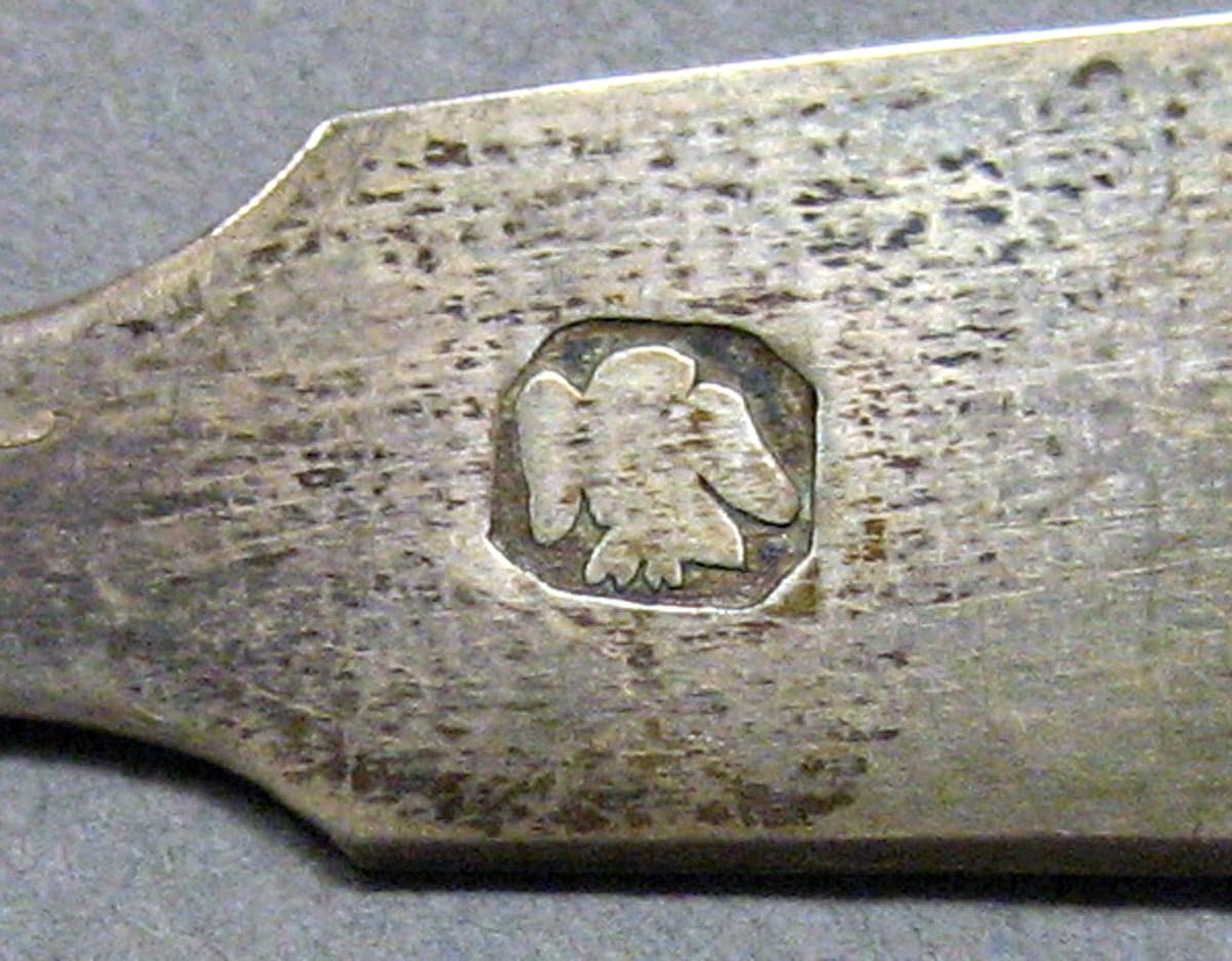1962.0240.862.001 Miniature spoon mark