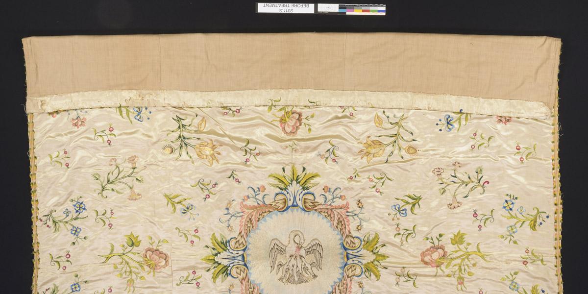 2011.0003 Bedcover, detail 1, before conservation treatment