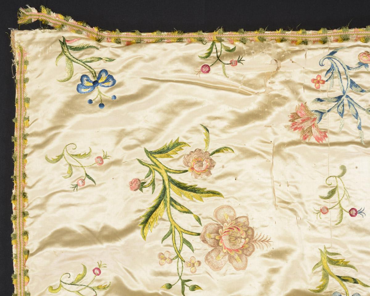 2011.0003 Bedcover, detail 2, before conservation treatment
