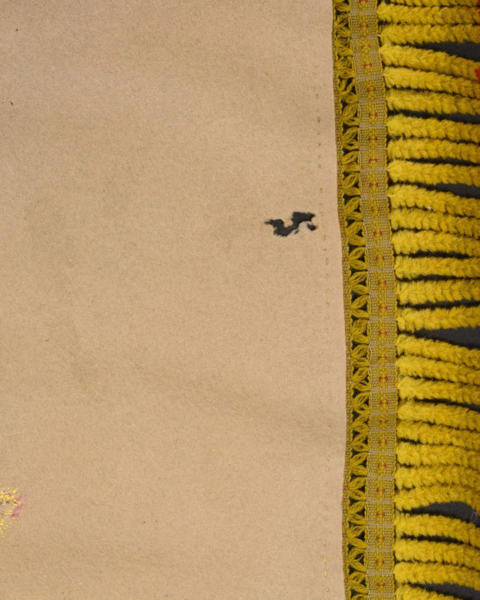2010.0049 Table cover, reverse, detail 2, before conservation treatment