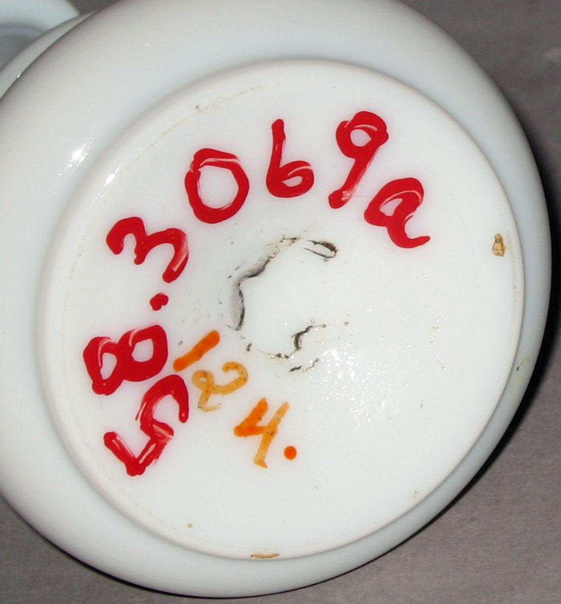 1958.3069 A White glass scent bottle (underside)
