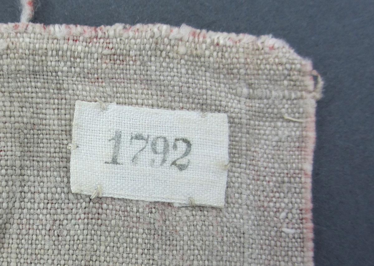 1969.8199.002 Textile, printed label