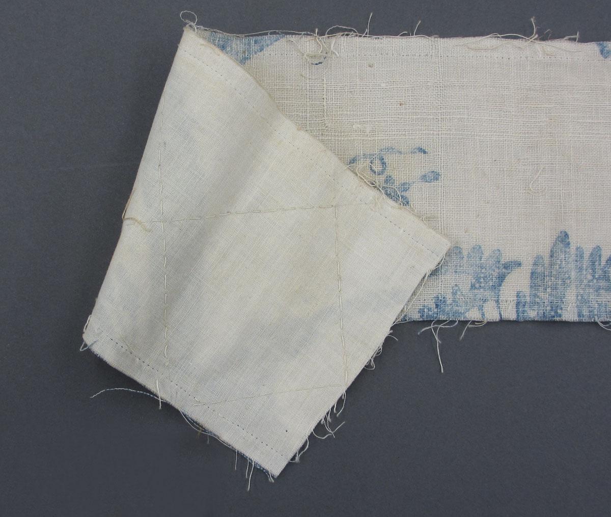 1969.8241.010 Textile, printed folded corner