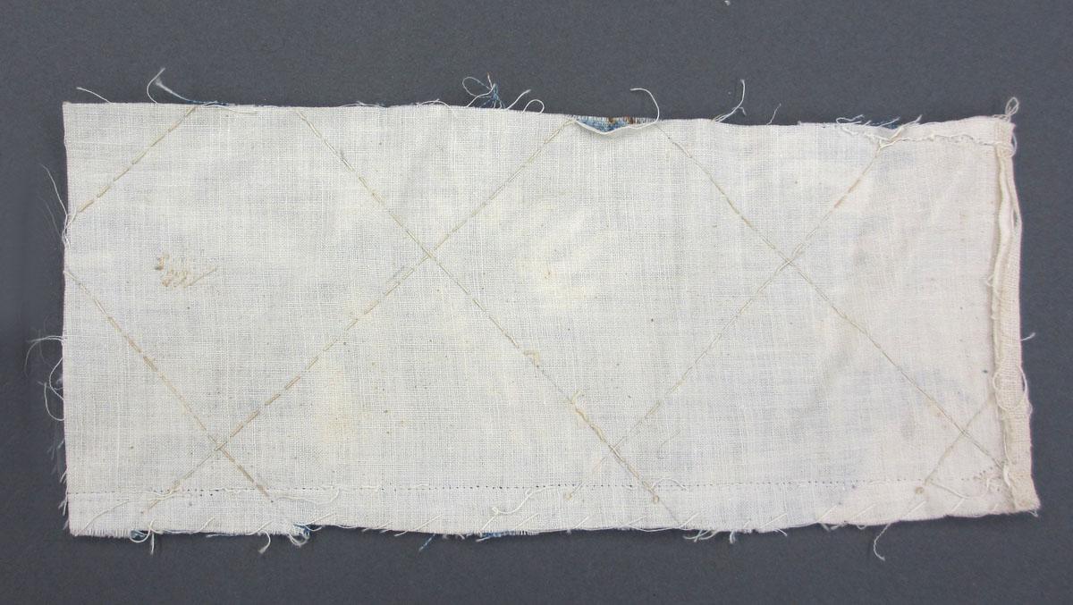1969.8241.012 Textile fragment, printed reverse