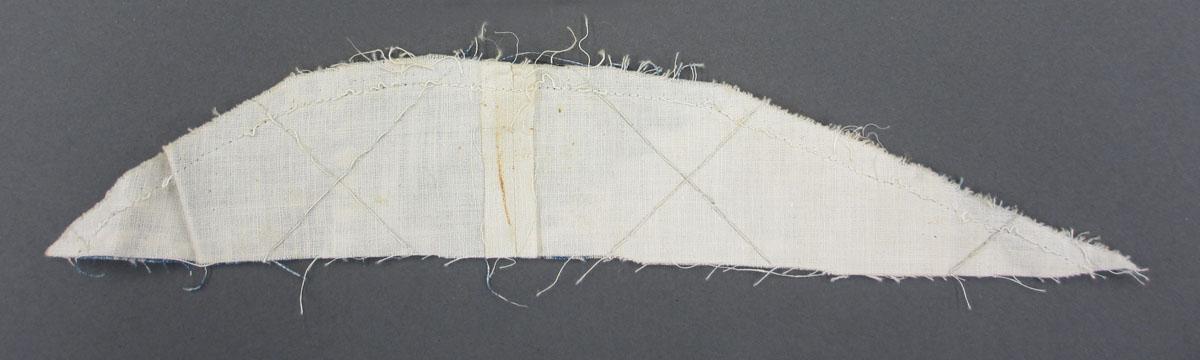 1969.8241.015 Textile scrap, printed reverse