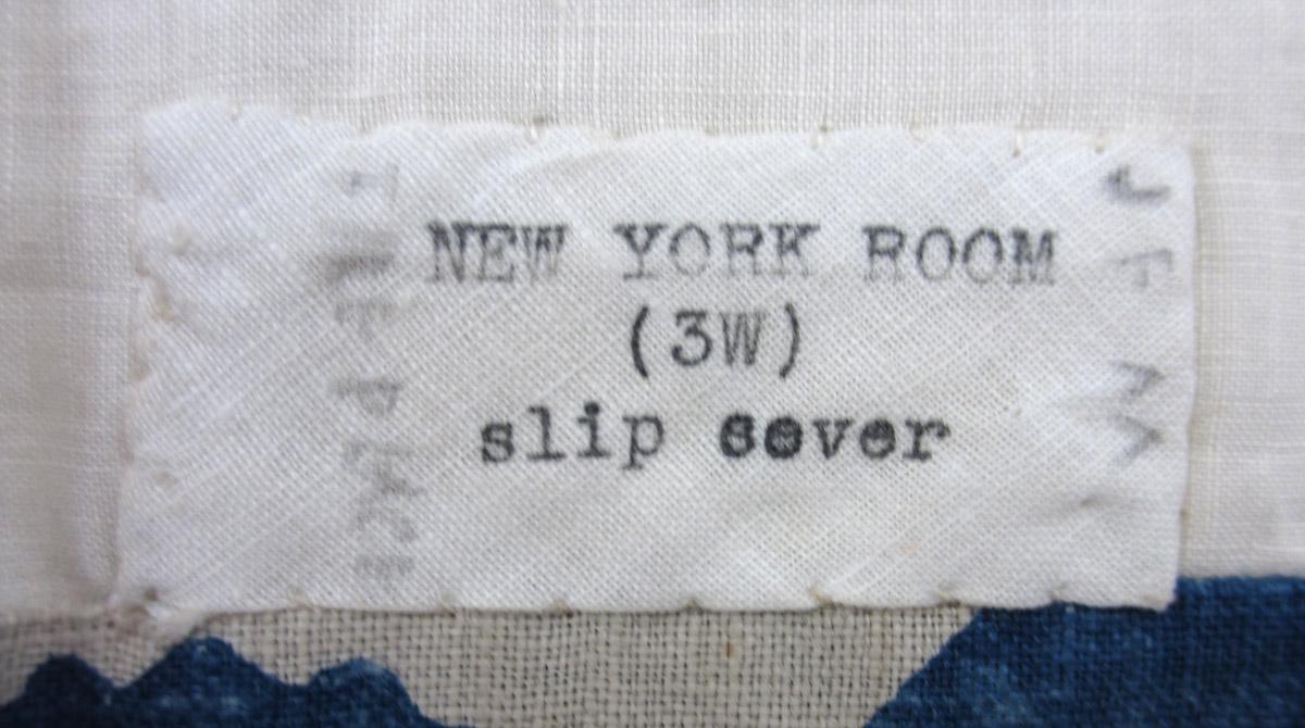 1969.8421.002 Slip cover, label