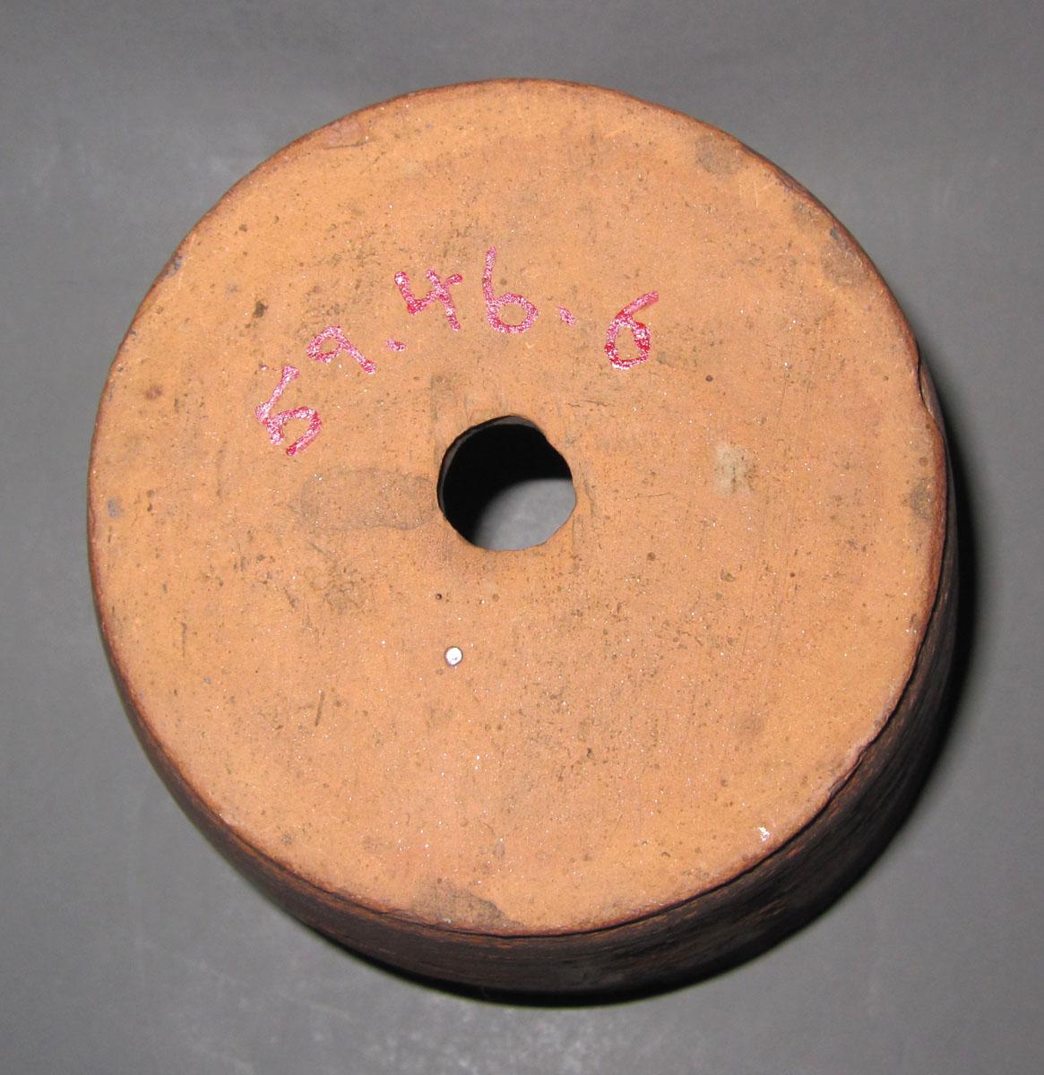 1959.0046.006 Redware flower pot underside