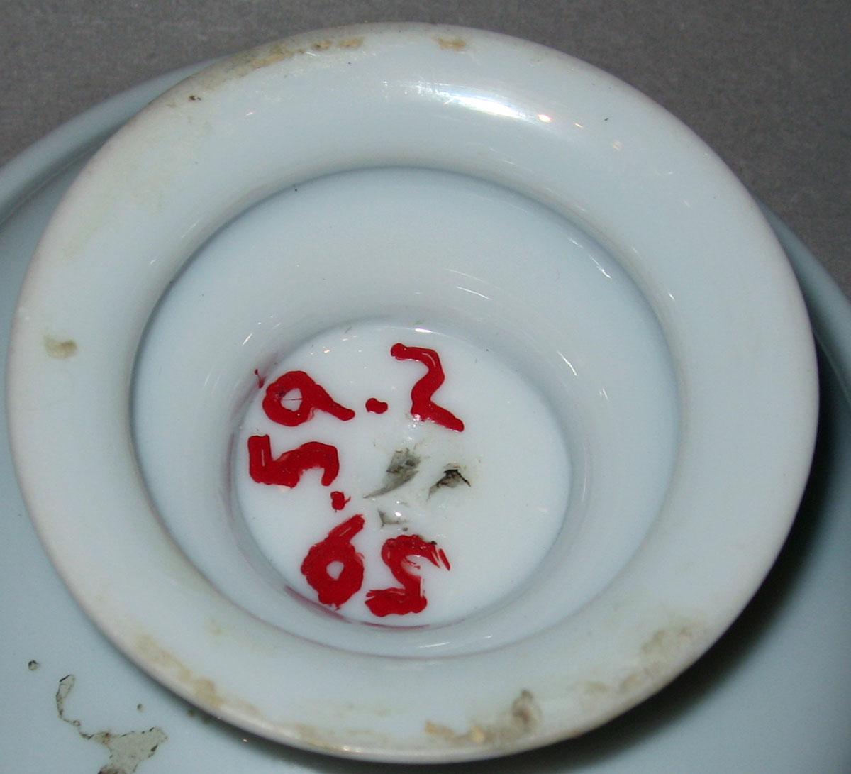 1959.0059.002 White glass footed dish (underside)