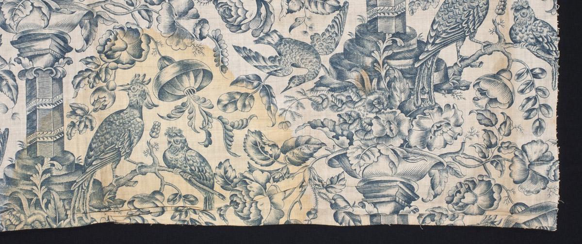 1959.0081.009 Textile, printed, detail 2, before conservation treatment