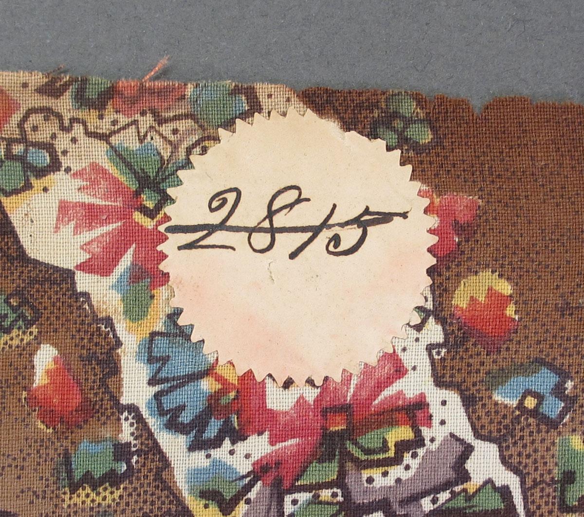 1959.0084.048 Textile, printed label