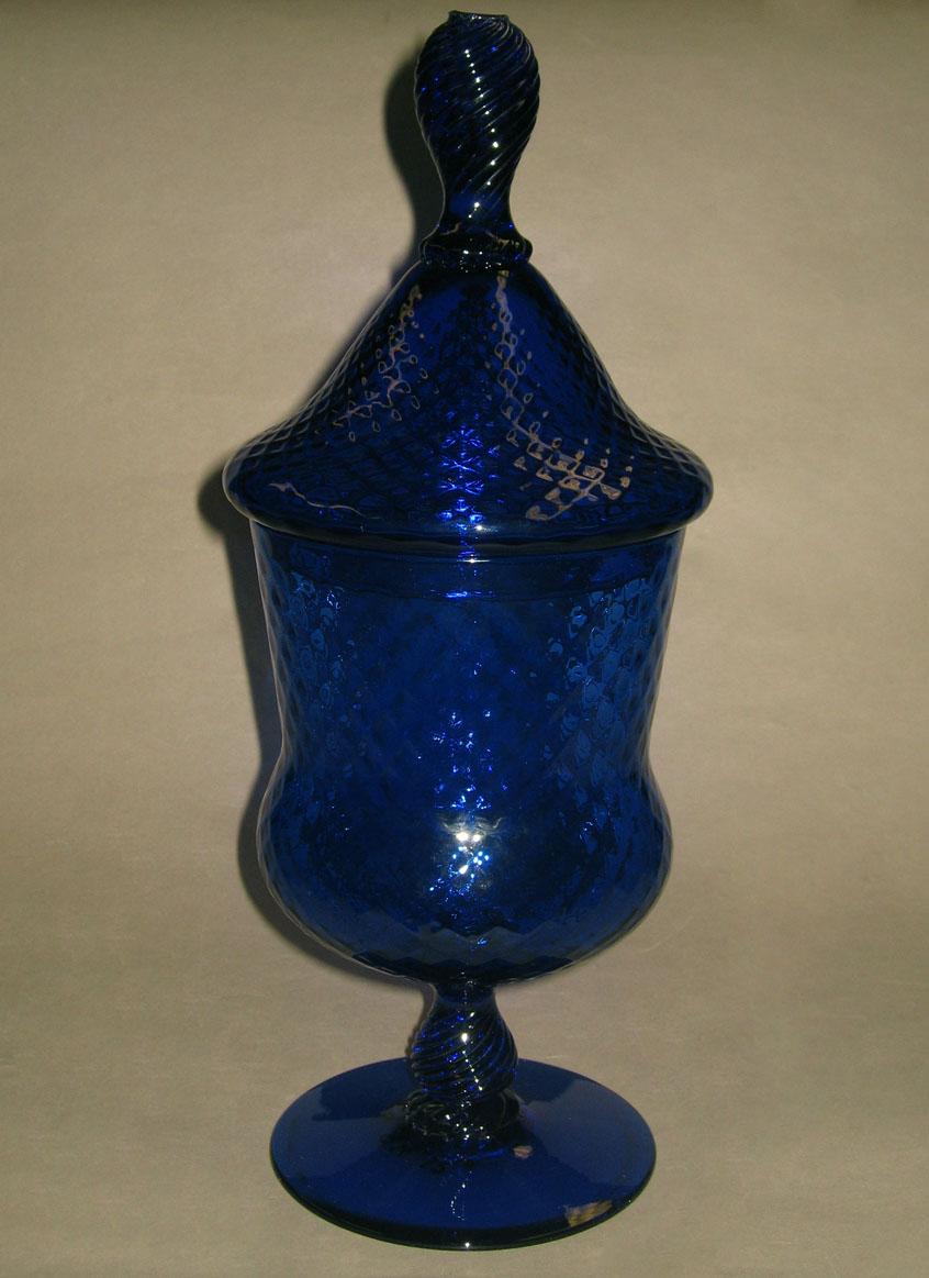 1959.0094.012 A, B Blue glass covered vase