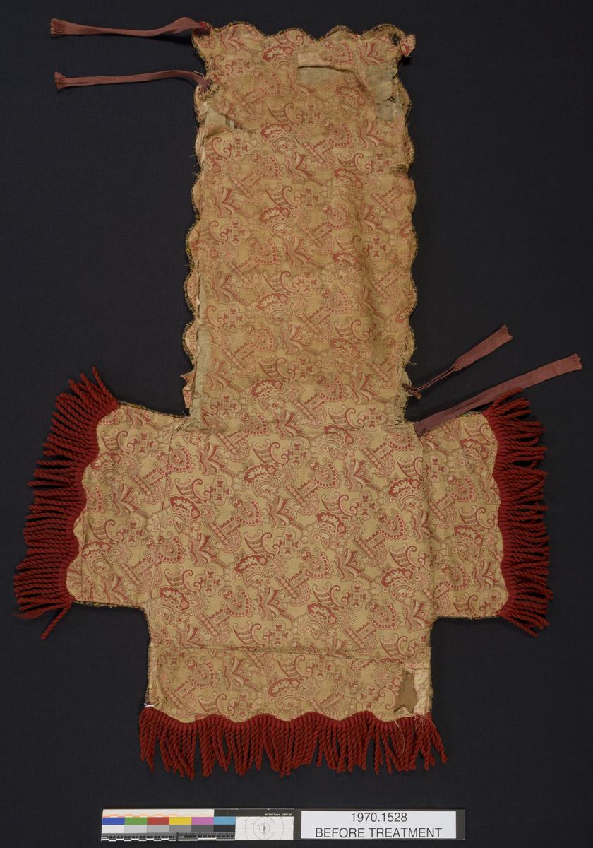 1970.1528 Chair cover, reverse, before conservation treatment