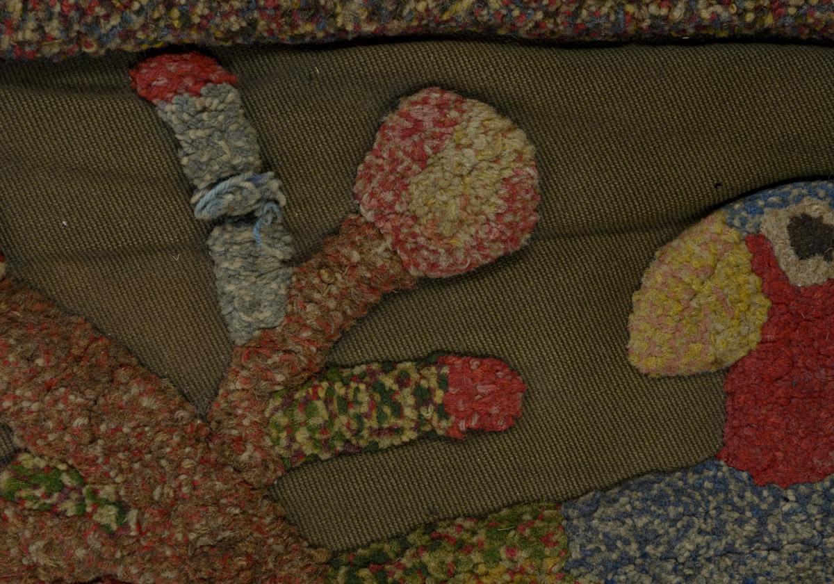 1970.1528 Chair cover, detail 1, before conservation treatment