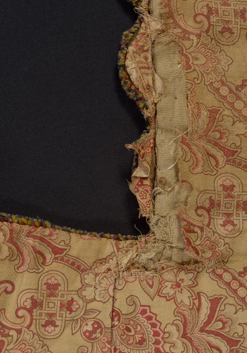 1970.1528 Chair cover, reverse, detail 2, before conservation treatment