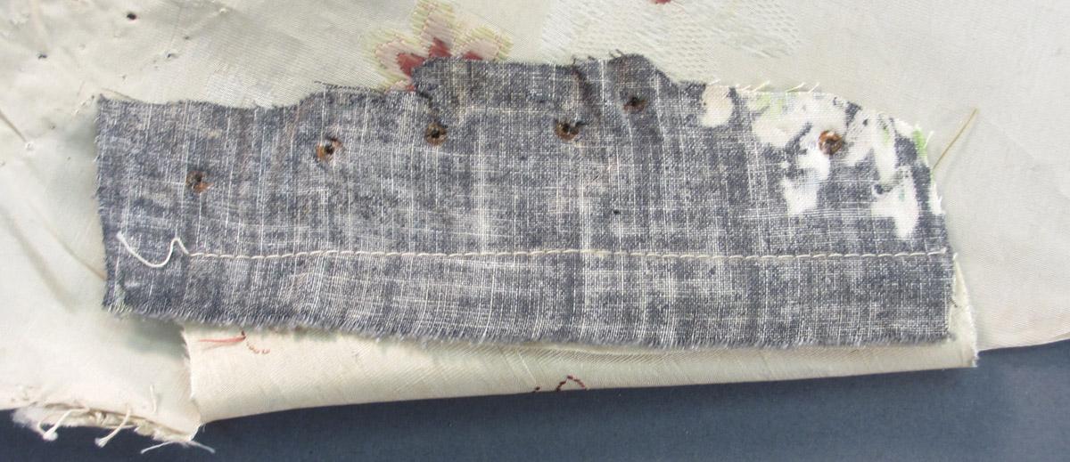 1952.0174 D Textile, woven folded corner