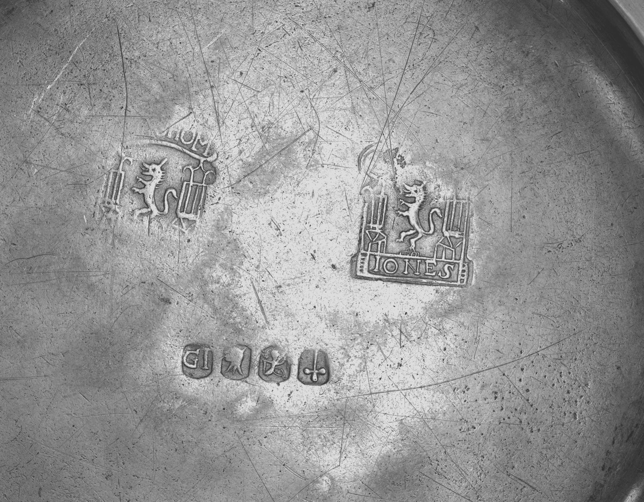 1953.0155.012 Pewter plate (marks)