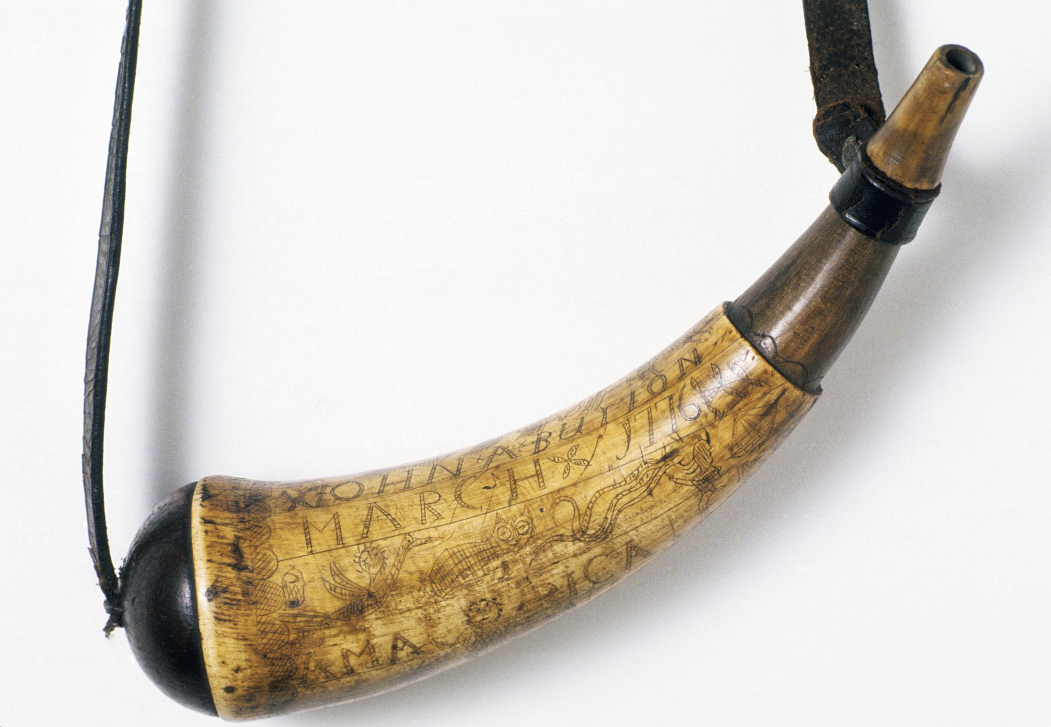 1965.2744 A Powder horn, B Strap